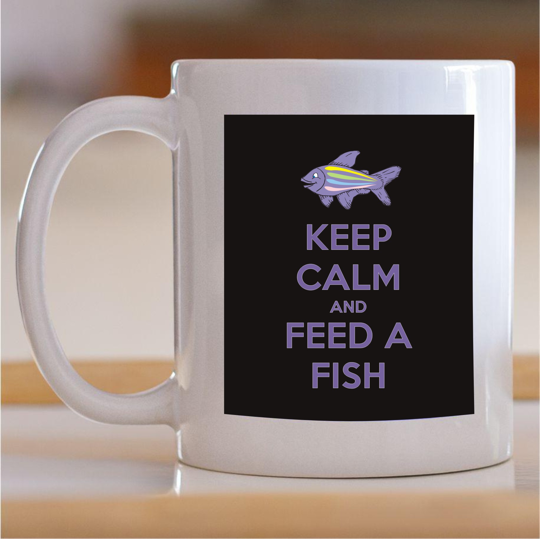 55.552-Keep-calm-and-feed-a-fish Šolja Keep calm and feed a fish - Slika 1